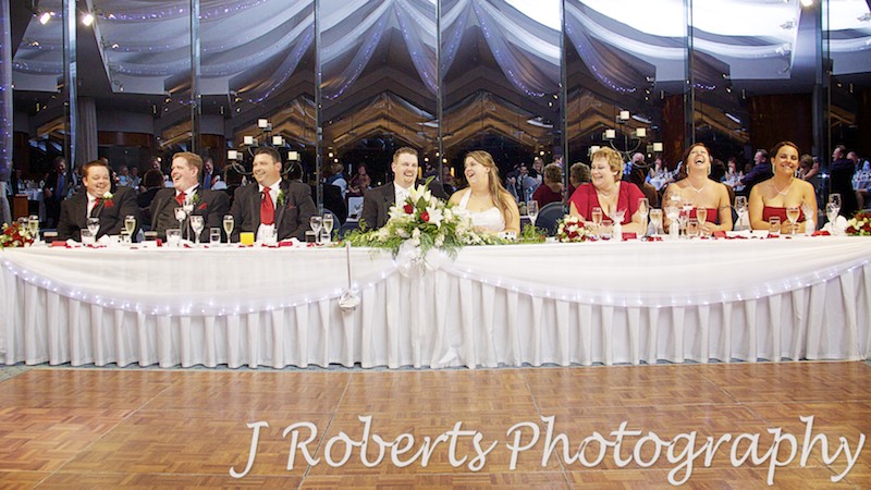 Bridal table laughing at speeches - wedding photography sydney